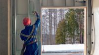 A worker applying spray foam