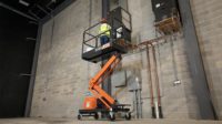 A worker using an aerial lift