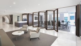 A law office featuring a NanaWall Generation 4 acoustical, wood-framed, folding glass wall system.