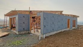 The frame of a new house with insulation installed